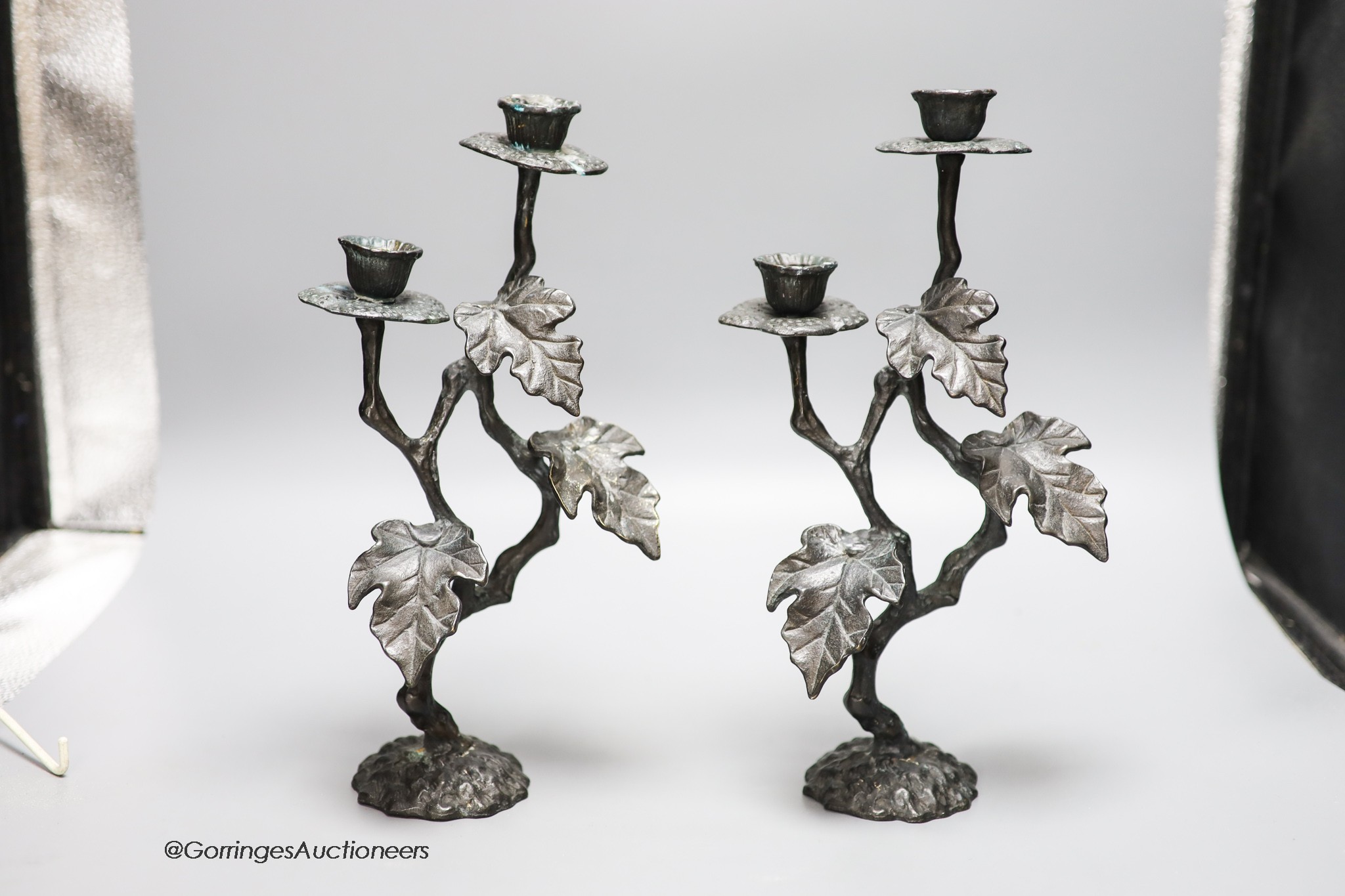 A pair of painted brass two branch candelabra, height 30cm